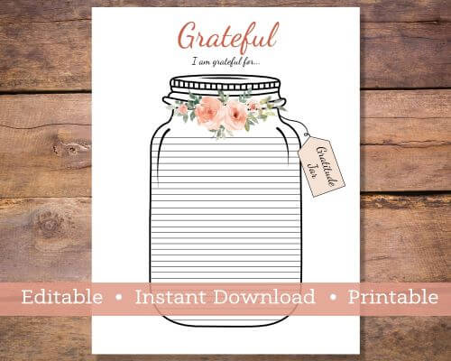 A piece of white paper with a Jar on it.  The jar has a flowers around the top and it is lined to write in what you are grateful for.