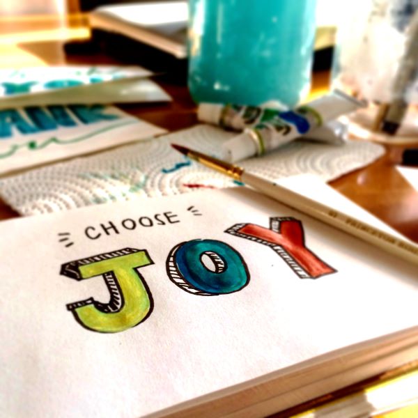 Painting that says "Choose Joy" to live life to the fullest