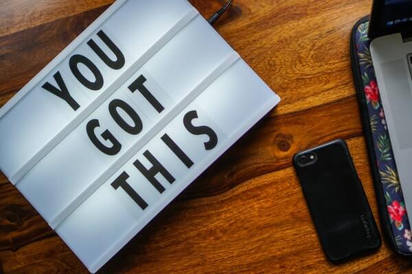 A sign on a desk that says "You Got This: