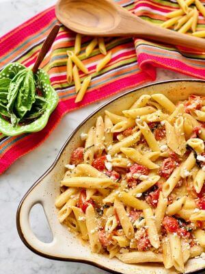 A dish of baked feta and tomato pasta