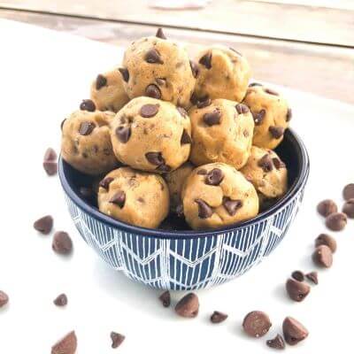 A bowl of no-bake cookie dough balls with chocolate chips