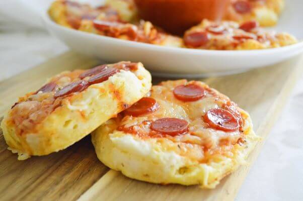 Mini Pizzas made on biscuits with cheese and pepperoni on top